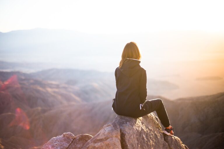 people, woman, travel, adventure, nature, trek, mountain, rock, sunset, cliff, black, hoodie, jacket, alone, thinking, freedom